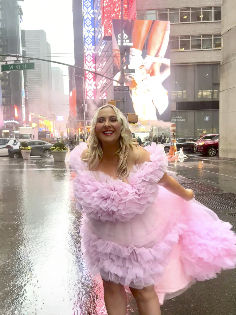 Julie NY Branding Photo in pink dress in the rain in Times Square